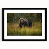 Framed wall art showcasing a charming brown bear design with a black frame and mat, perfect for enhancing cozy living spaces or children's rooms.