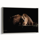 Framed wall art featuring a brown bear design on canvas, elegantly displayed with a sleek silver frame, ideal for nature-themed home decor.