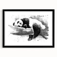 Black-framed wall art featuring a cute panda bear design, set against a minimalist white background, perfect for children's rooms or playful decor themes.