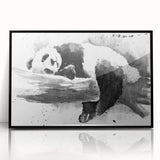 Framed acrylic wall art featuring a playful panda bear design, set against a sleek black background, perfect for children's room decor and contemporary art enthusiasts.