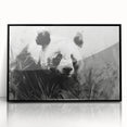 Framed acrylic wall art featuring a playful panda bear design in vibrant colors, perfect for children's rooms or playful decor. The artwork showcases a black frame that enhances its visual appeal, making it a charming addition to any space.