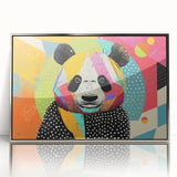 Framed wall art featuring a whimsical panda bear design in vibrant colors, set in a sleek silver frame, ideal for children's rooms or playful decor.