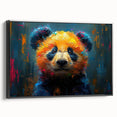 Framed canvas wall art featuring a playful panda bear design in vibrant colors, displayed from a black side view, perfect for children's rooms or playful decor.