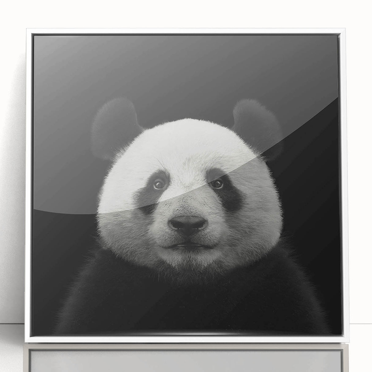 Framed wall art featuring a whimsical panda bear design in a white frame, showcasing vibrant colors and playful details, ideal for children's room decor.
