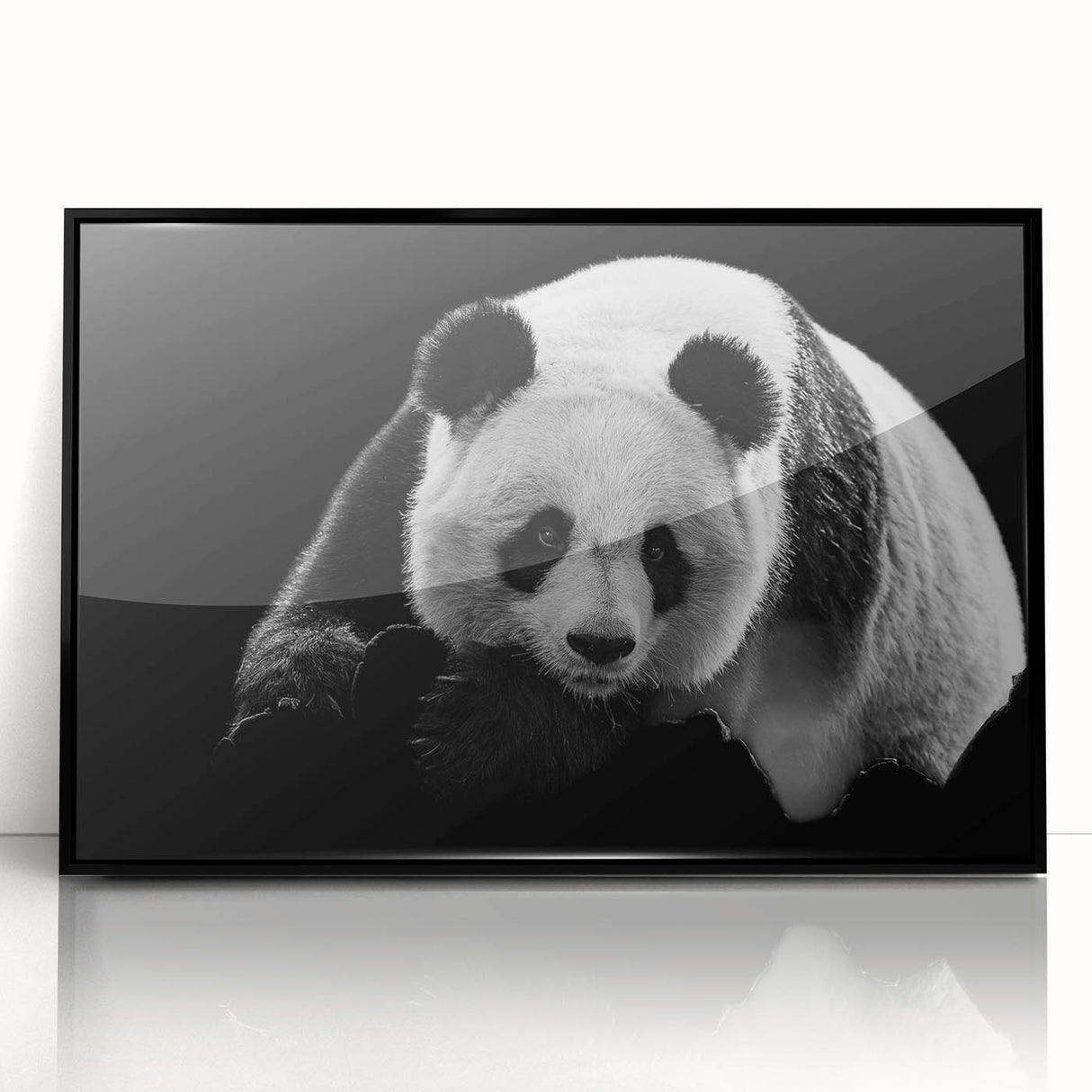Framed wall art featuring a whimsical panda bear design in vibrant colors, showcasing playful details against a black frame, perfect for children's rooms or playful decor.
