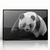 Framed wall art featuring a whimsical panda bear design in vibrant colors, showcasing playful details against a black frame, perfect for children's rooms or playful decor.