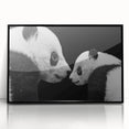 Framed wall art featuring a panda bear design in vibrant colors, presented in an acrylic frame with a sleek black border, ideal for children's rooms or playful decor.