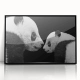 Framed wall art featuring a panda bear design in vibrant colors, presented in an acrylic frame with a sleek black border, ideal for children's rooms or playful decor.