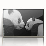 Framed acrylic wall art featuring a playful panda bear design on a silver background, ideal for children's rooms or nurseries, adding a whimsical touch to home decor.