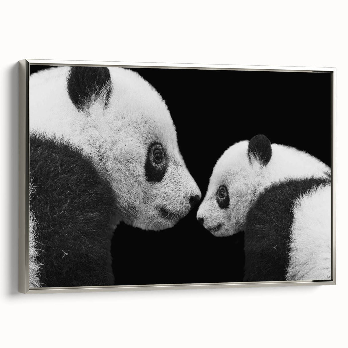 Framed canvas wall art featuring a playful panda bear design in a silver frame, showcasing vibrant colors and intricate details, ideal for children's decor.