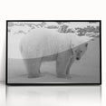 Framed wall art featuring a striking polar bear design in black and white, displayed in a sleek black frame, perfect for adding a modern touch to home decor.
