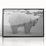 Framed wall art featuring a striking polar bear design in black and white, displayed in a sleek black frame, perfect for adding a modern touch to home decor.