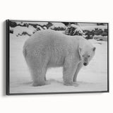 Framed black canvas wall art featuring a striking polar bear design, showcasing intricate details and textures, perfect for adding a modern touch to home decor.