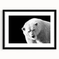 Polar bear wall art framed in black with a white mat, showcasing a minimalist design. Perfect for wildlife enthusiasts or modern decor lovers.