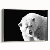 Framed wall art featuring a polar bear design on a textured canvas, showcasing a silver frame. Ideal for adding a contemporary wildlife touch to home decor.