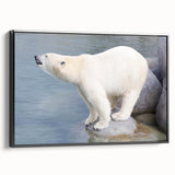 Framed canvas wall art featuring a polar bear design with a black frame, showcasing a side view of the artwork against a neutral background, ideal for wildlife decor.
