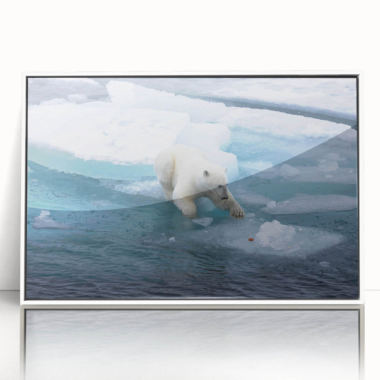 Framed wall art featuring a polar bear design in a white acrylic frame, showcasing a serene Arctic landscape with soft blues and whites, ideal for home decor.