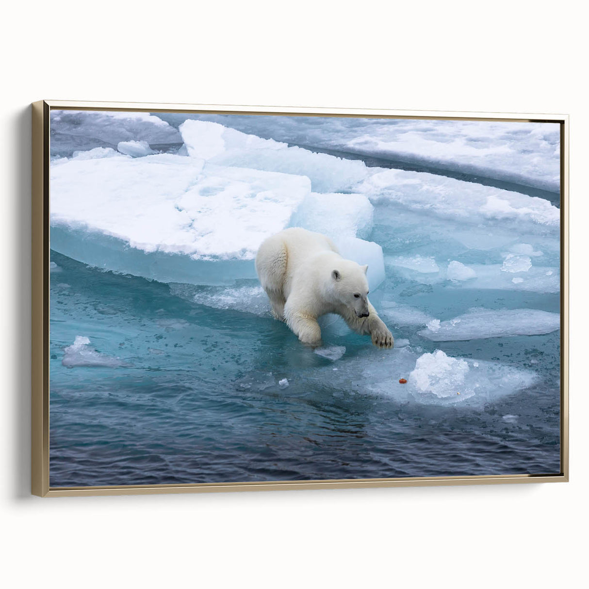 Framed wall art featuring a polar bear design in a gold frame, showcasing intricate details and a contemporary style, ideal for modern home decor.