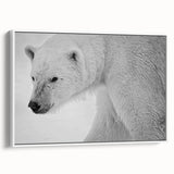 Framed canvas wall art featuring a polar bear design in a white frame, showcasing a side view of the bear against a minimalist background, perfect for modern decor.