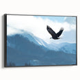 Framed wall art featuring a captivating birds of prey design on canvas, showcasing intricate details and rich colors, viewed from the side against a neutral backdrop.