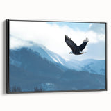 Framed wall art featuring a captivating birds of prey design on canvas, showcasing intricate details and rich colors, viewed from the side against a neutral backdrop.