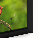 Close-up of a framed canvas wall art piece showcasing vibrant red cardinals perched on delicate branches, set against a soft, muted background, perfect for nature lovers.