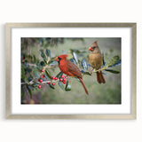 Framed wall art collection showcasing vibrant red cardinal birds against a serene nature backdrop, highlighted by a sleek silver frame and matting. Perfect for bird lovers and nature enthusiasts, this piece adds a touch of elegance to any home decor.