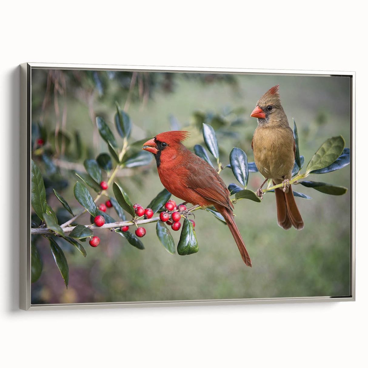 Framed wall art showcasing a cardinal bird design in vibrant red hues, elegantly displayed in a sleek silver frame, perfect for nature-inspired decor.