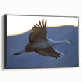 Framed canvas wall art featuring an elegant crane design in black, showcasing a side view that highlights its intricate details and sleek finish, perfect for modern home decor.