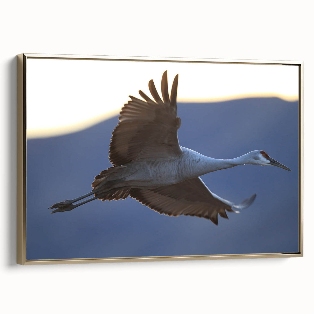 Framed canvas wall art featuring an elegant crane design in gold tones, set against a neutral background, perfect for adding sophistication to home decor.