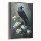Framed wall art showcasing a striking design of a crow and raven, set against a silver background, highlighting intricate details and a modern aesthetic.