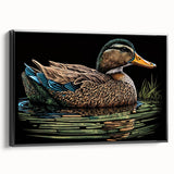 Framed canvas wall art showcasing a charming duck design, featuring a sleek black frame. The artwork is displayed in a side view, emphasizing its elegant presentation suitable for home decor.