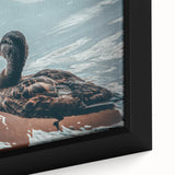 Close-up of a framed canvas wall art piece showcasing a colorful duck design, featuring vibrant hues of blue and orange, perfect for enhancing home decor.