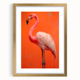 Framed wall art featuring a vibrant flamingo design, elegantly matted with a gold frame, perfect for adding a touch of tropical charm to any room decor.
