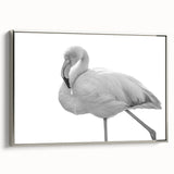 Framed canvas wall art featuring a stunning flamingo design in vibrant colors, elegantly displayed with a silver frame, ideal for enhancing modern decor.
