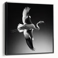 Framed canvas wall art showcasing a vibrant flamingo design in pink and black, displayed in a sleek black frame from a side view, perfect for modern decor.