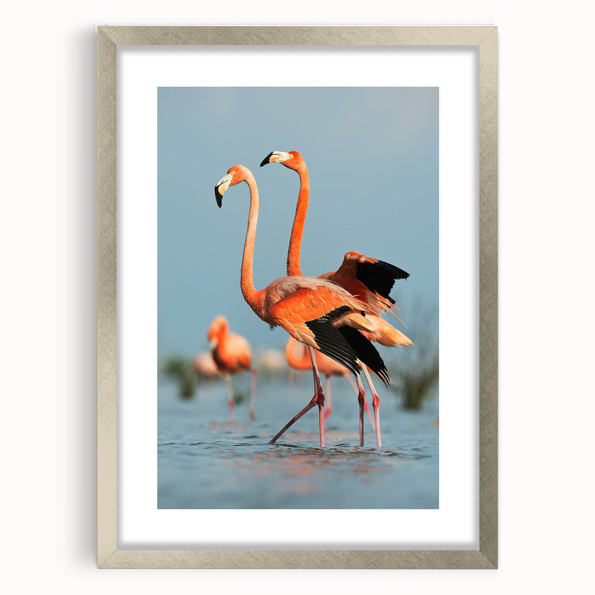 Framed wall art featuring a vibrant flamingo design in shades of pink and green, elegantly presented in a silver frame with a mat, perfect for enhancing any modern decor.