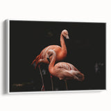 Framed wall art featuring a vibrant flamingo design on canvas, showcasing a modern aesthetic in a white frame, ideal for stylish home decor.