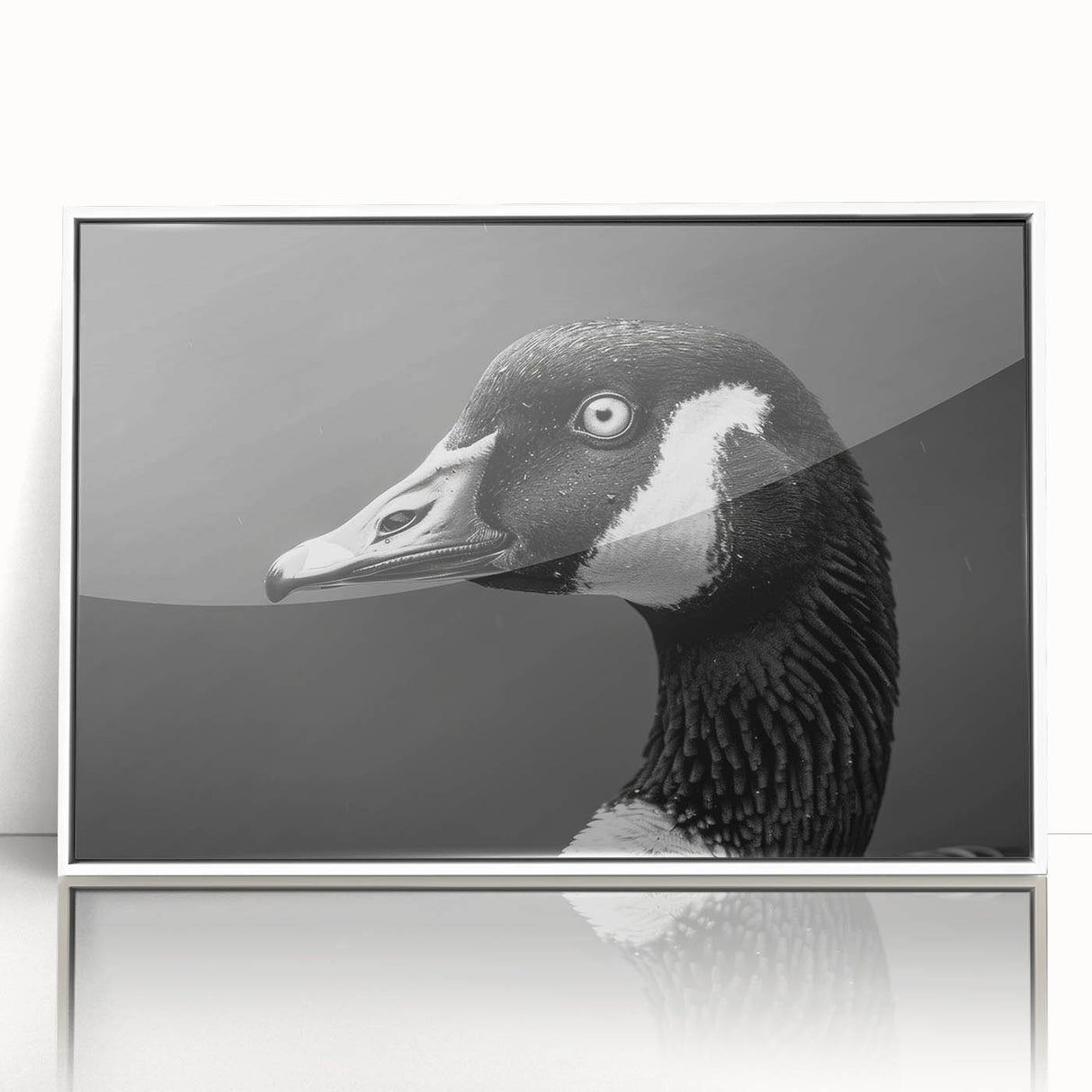 Framed wall art showcasing a detailed goose design, featuring vibrant colors on an acrylic surface. The artwork is presented in a sleek white frame, enhancing any modern decor. Perfect for nature lovers and art enthusiasts.