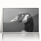 Framed wall art showcasing a detailed goose design, featuring vibrant colors on an acrylic surface. The artwork is presented in a sleek white frame, enhancing any modern decor. Perfect for nature lovers and art enthusiasts.