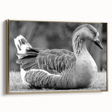 Framed canvas wall art featuring a stylish goose design in gold hues, showcasing a modern aesthetic suitable for home decor. The artwork is elegantly displayed from a side view, highlighting its intricate details and premium framing.