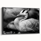 Framed wall art featuring a striking goose design on canvas, presented in a sleek black frame, ideal for modern home décor. This piece adds elegance and nature-inspired charm to any interior setting.