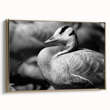 Framed canvas wall art showcasing a serene goose design in gold tones, elegantly displayed from a side view, ideal for enhancing modern decor.