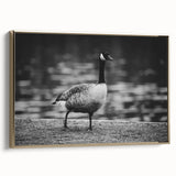 Framed wall art featuring a serene goose design on canvas, showcasing elegant gold accents and a side view, perfect for home decor enthusiasts.