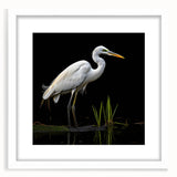 Elegant framed wall art featuring a heron and egret design, showcasing intricate details and soft colors against a white mat, perfect for nature-inspired decor.
