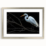 Elegant silver-framed wall art featuring a heron and egret design, perfect for adding a touch of nature to home decor. The mat enhances the artwork's visual appeal.