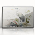 Framed wall art featuring a heron and egret design, showcasing intricate details in black and white with a sleek black frame, perfect for modern decor.