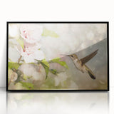 Framed wall art showcasing a vibrant hummingbird design in black acrylic, set against a sleek black frame, perfect for adding color and elegance to any room decor.