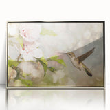 Framed wall art featuring a detailed hummingbird design in vibrant colors, showcased in a sleek silver frame, perfect for enhancing modern decor.
