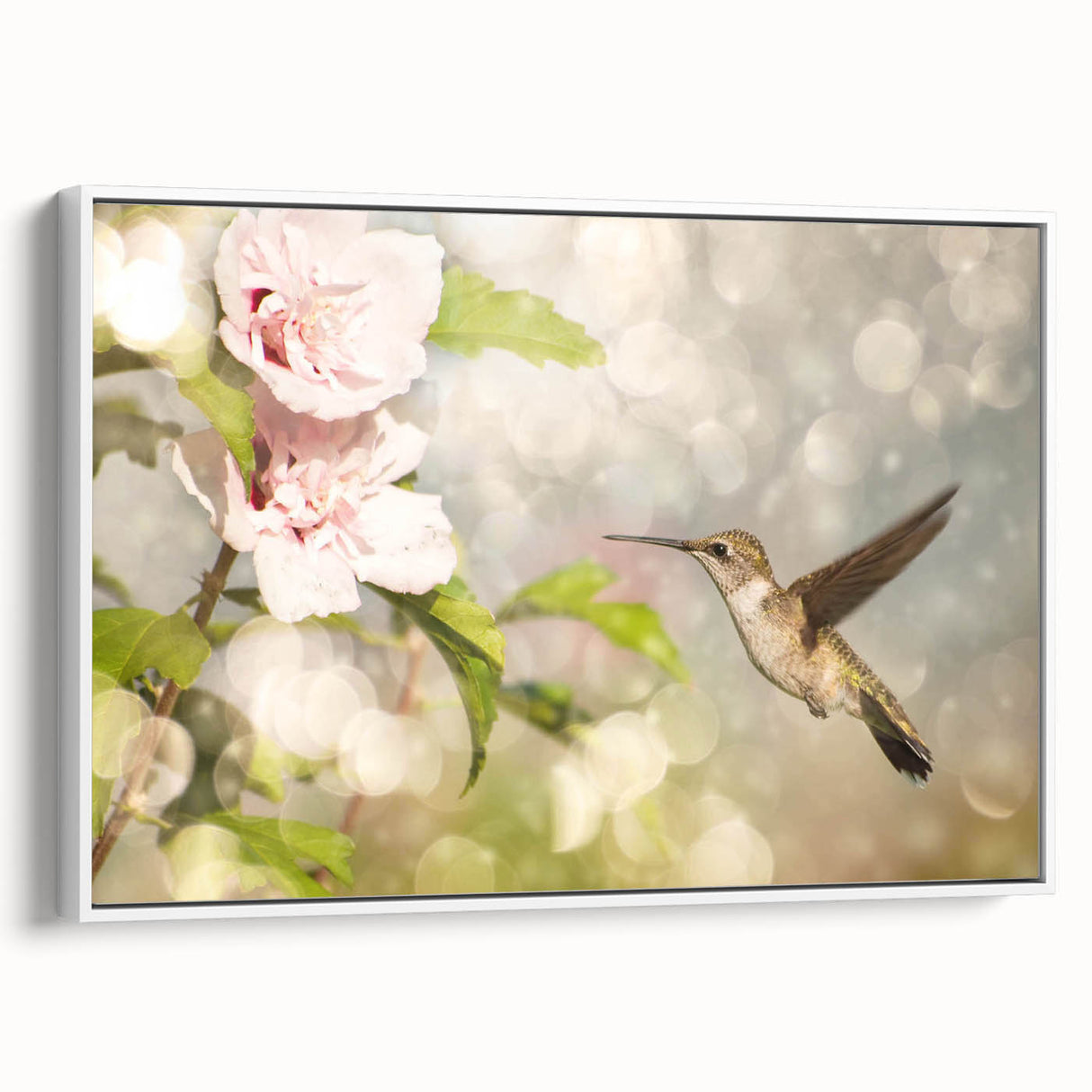 Framed wall art showcasing a vibrant hummingbird design in shades of green and blue, set against a white background, ideal for enhancing modern home decor.